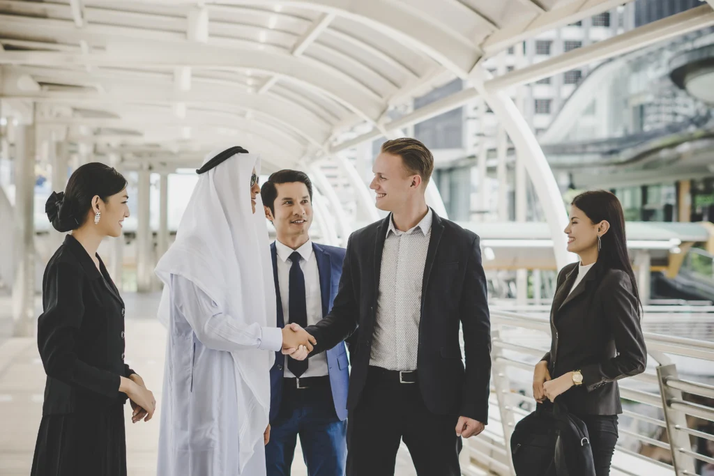 Business professionals and foreign investors meeting in Dubai, UAE, discussing company formation, business setup, and investment opportunities